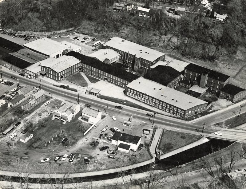 Aerial view of Windsor Print Works, with the north branch of the Hoosic River in the foreground.