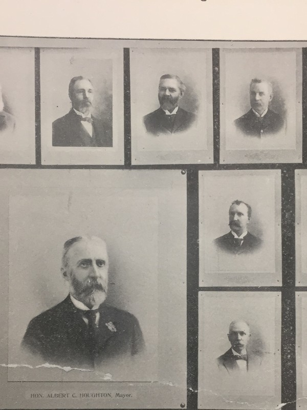 The photo third from left depicts a picture of Edward S. Wilkinson. He was a clerk under Mayor Houghton. He later became the third mayor of North Adams himself. He was only mayor for two year, 1900 to 1902 before he died in office. <br />
Rowe, Henry G., and Charles Telford Fairfield. North Adams and vicinity illustrated. An illustrated book of North Adams, Adams and Williamstown, Massachusetts, their industries, past and present.  North Adams: Transcript Pub. Co., 1898.