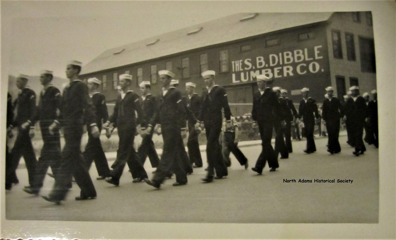 S.B. Dibble Lumber Company in the background during a parade in North Adams in the 1940s.