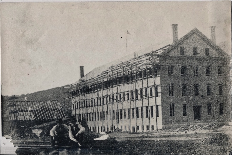 Oliver and Harvey Arnold during construction of Arnold Print Works factory at Marshall Street.  c. 1861-3