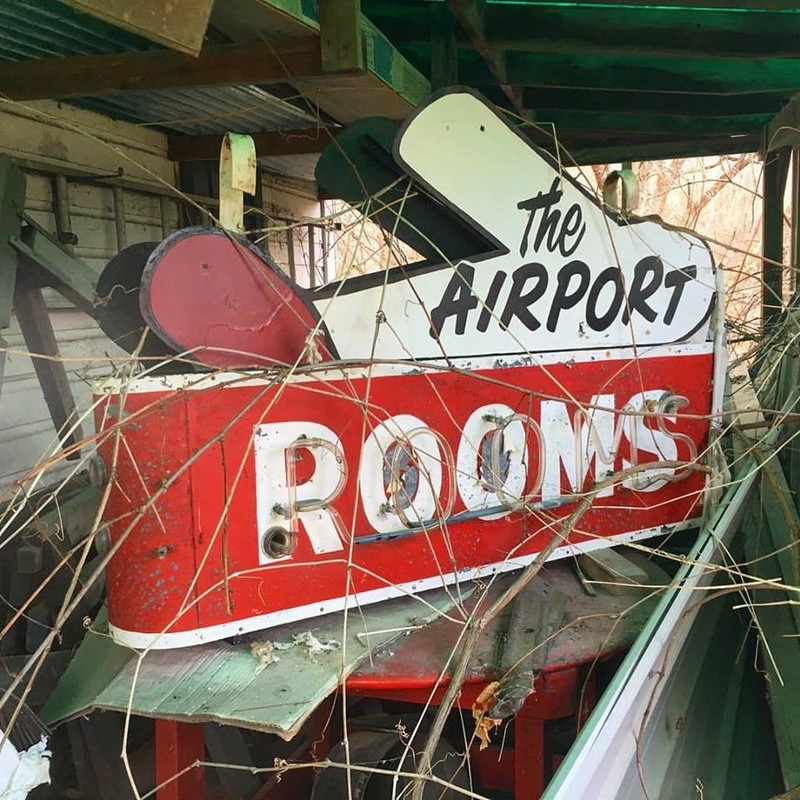The Old Sign from the Airport Tourists Home and Rooms.